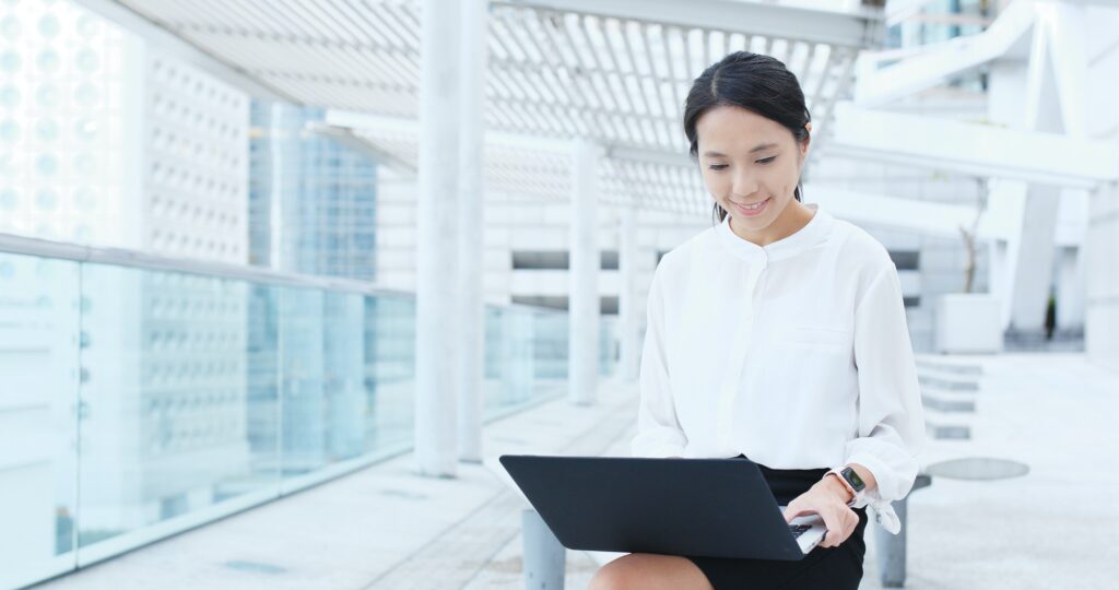 Asian Business woman work on laptop computer